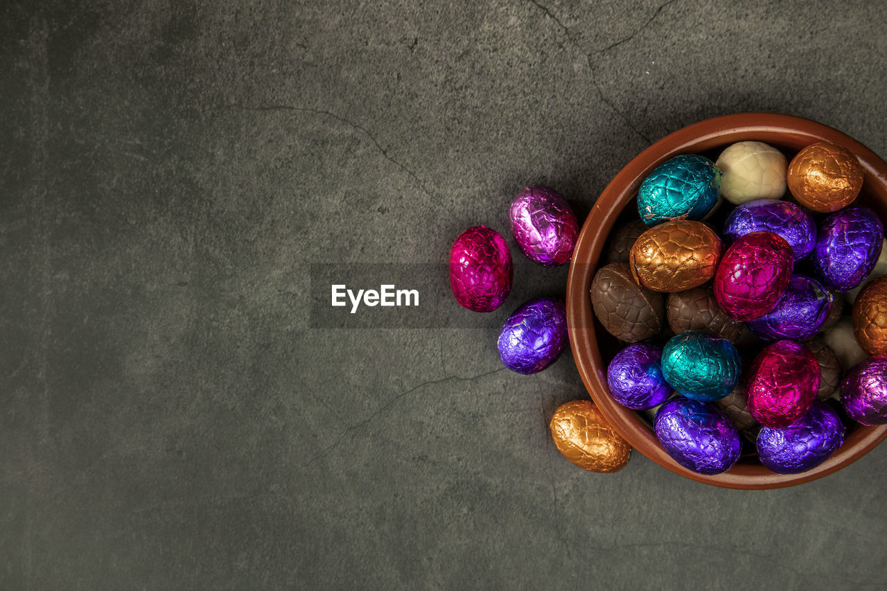 high angle view of multi colored easter eggs on table