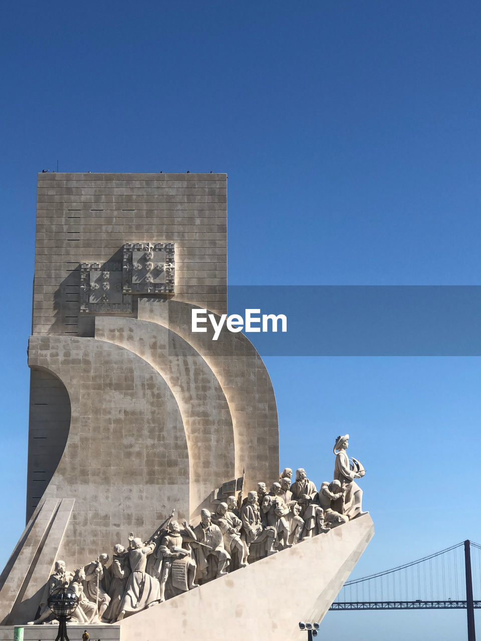 Low angle view of statue against clear blue sky