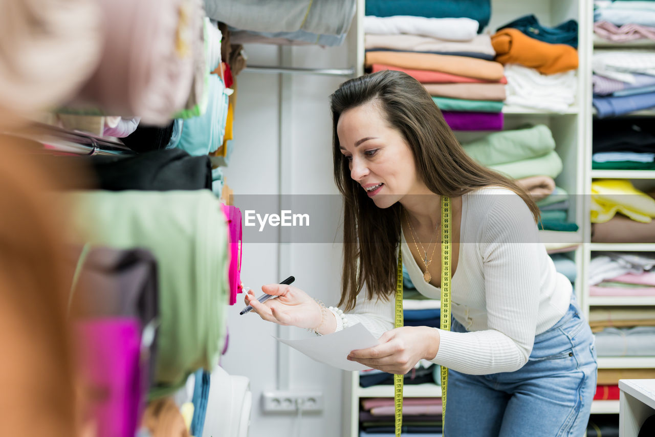 Woman working at clothing store