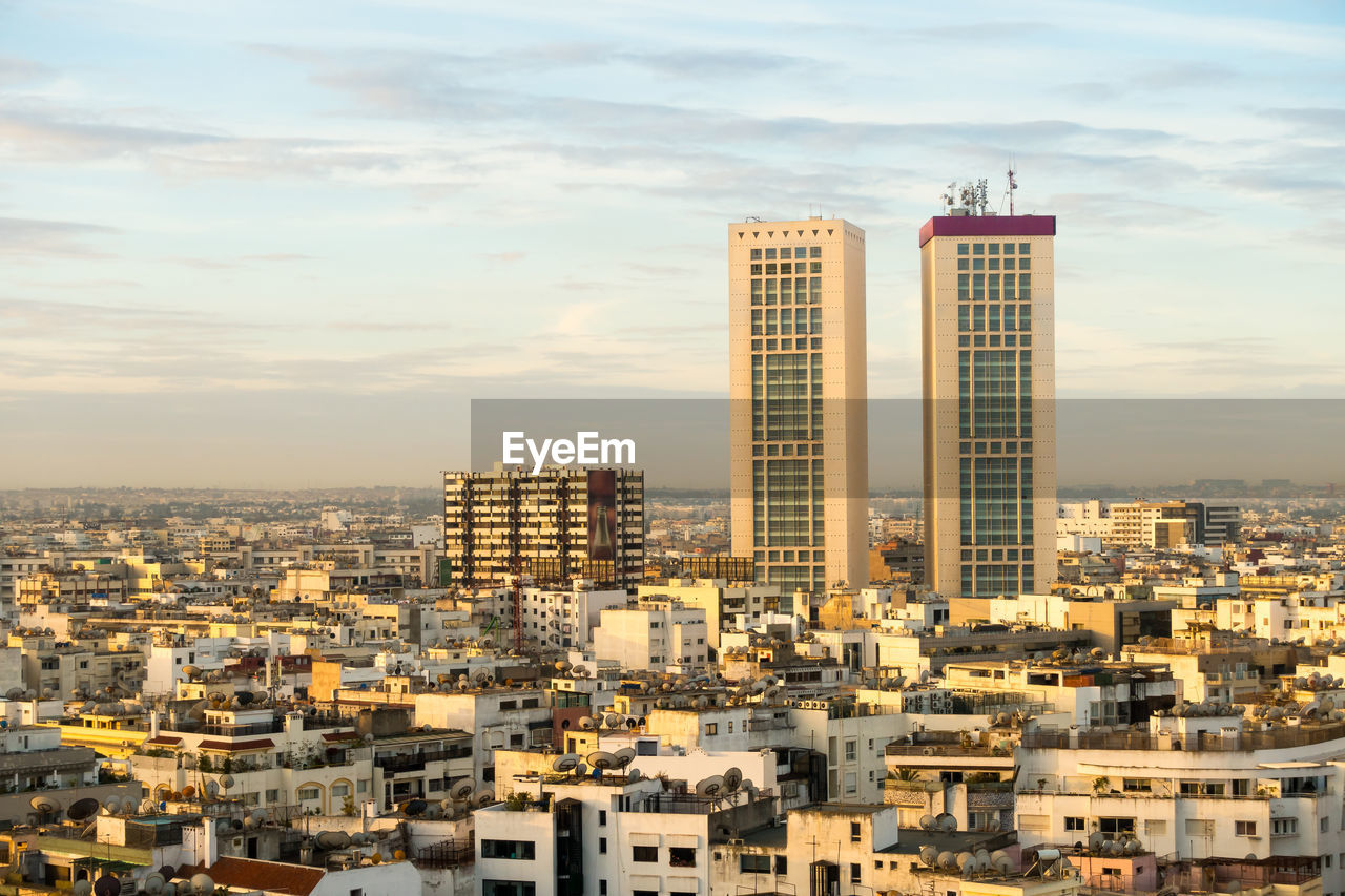 Modern buildings in city against sky