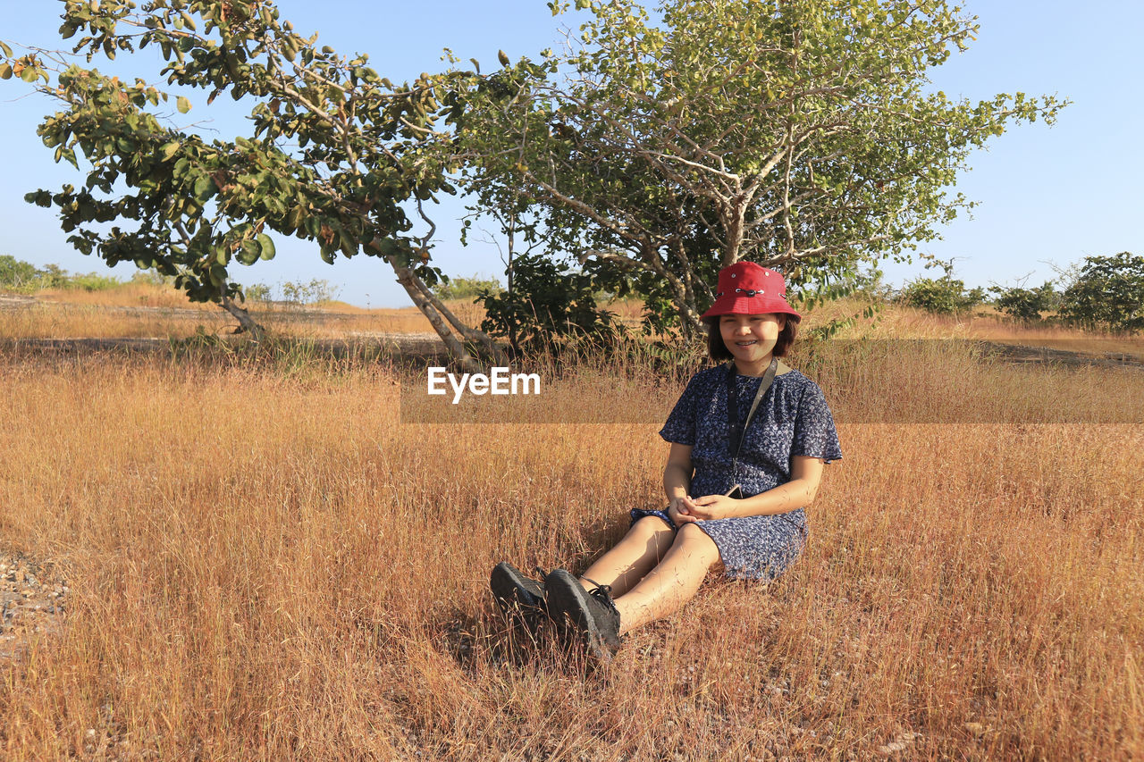 Young woman in wheat field,pha taem in thailand.