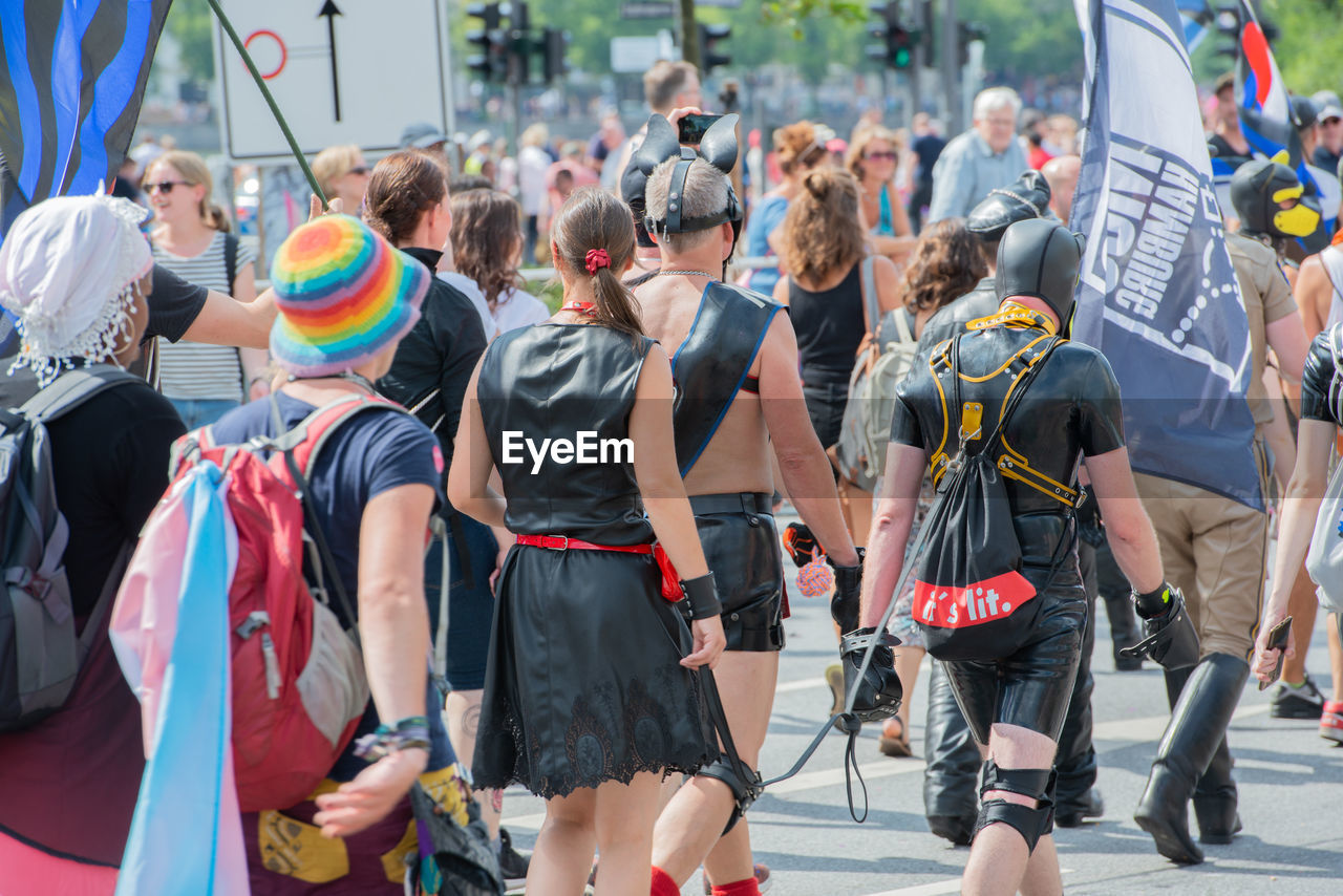 GROUP OF PEOPLE WALKING IN STREET