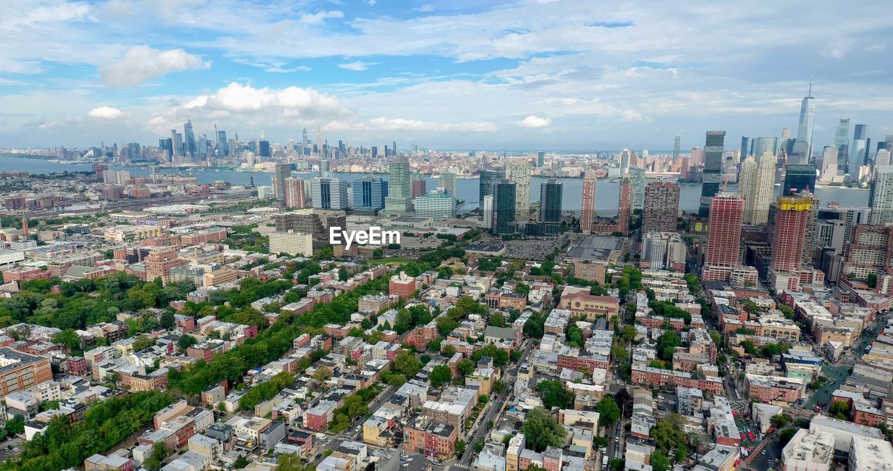 High angle view of buildings in city against sky