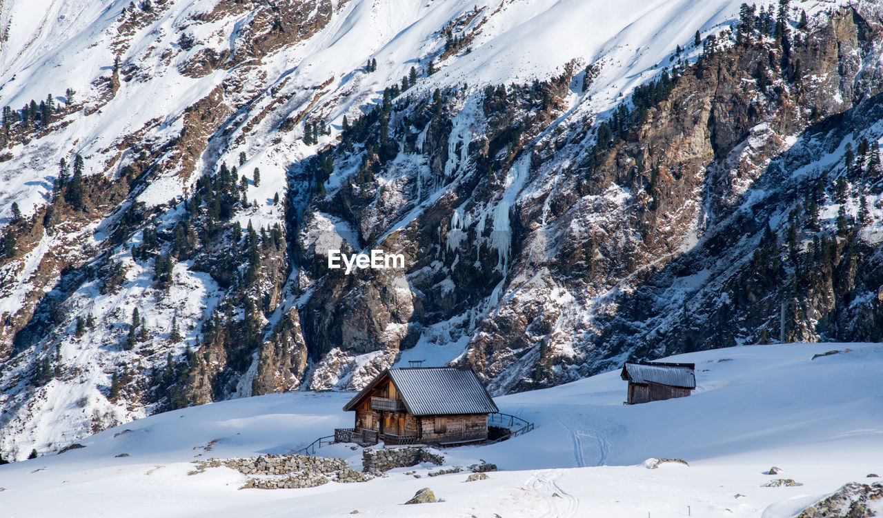 Scenic view of snow covered mountains