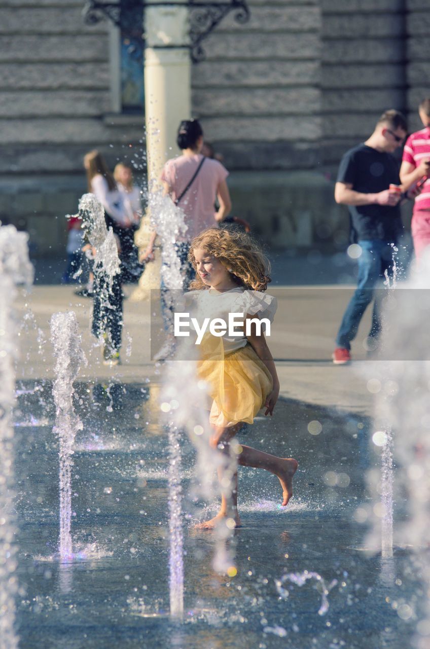 GROUP OF PEOPLE IN WATER