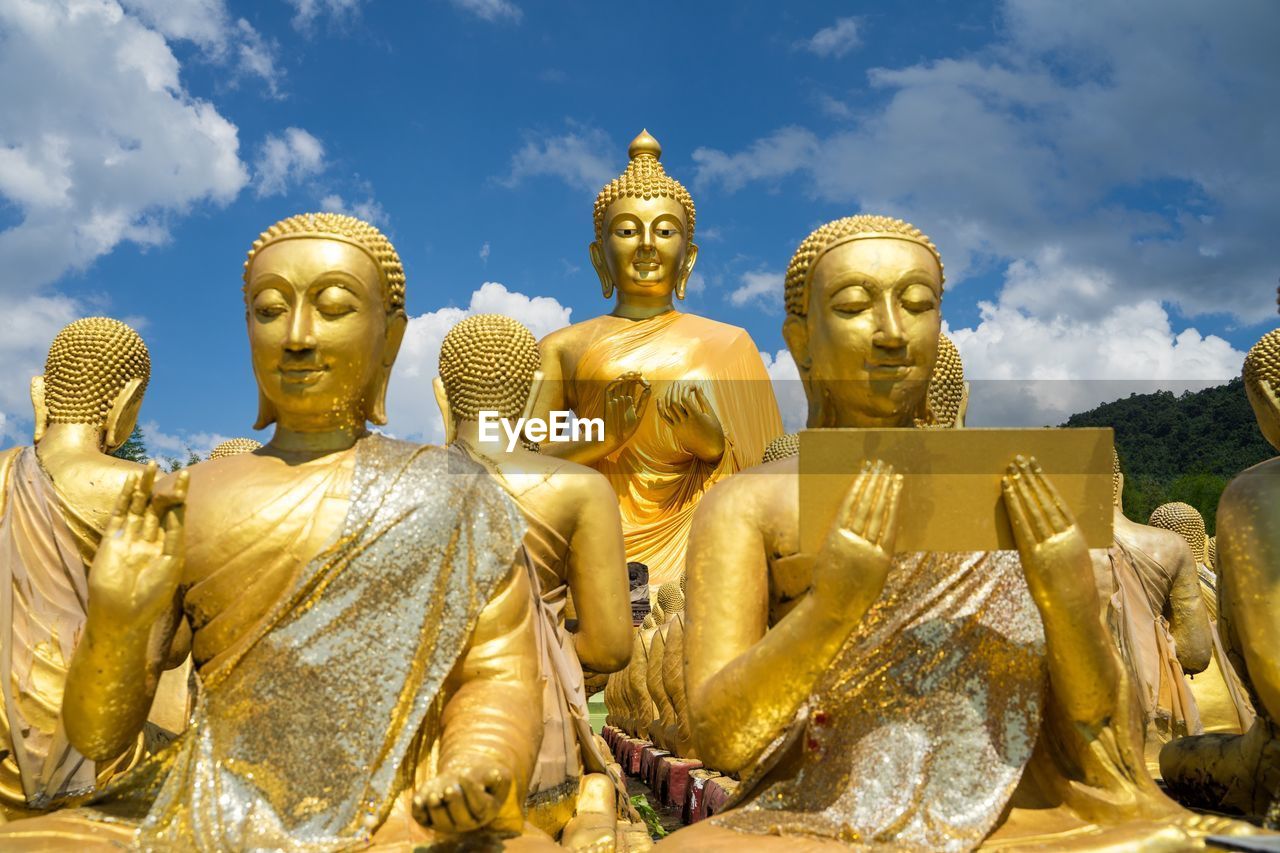 LOW ANGLE VIEW OF SCULPTURES AGAINST SKY