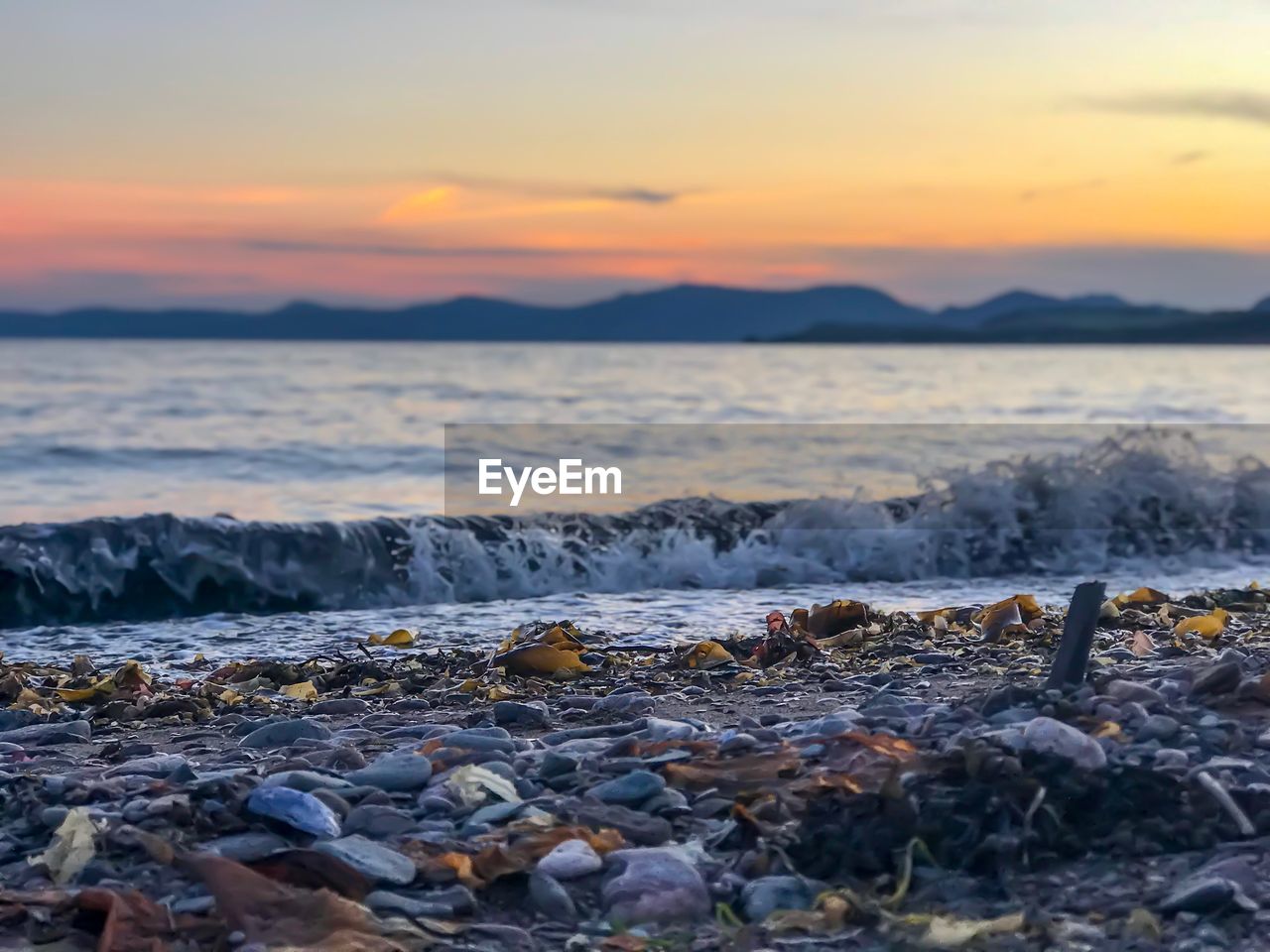 SCENIC VIEW OF SEA DURING SUNSET