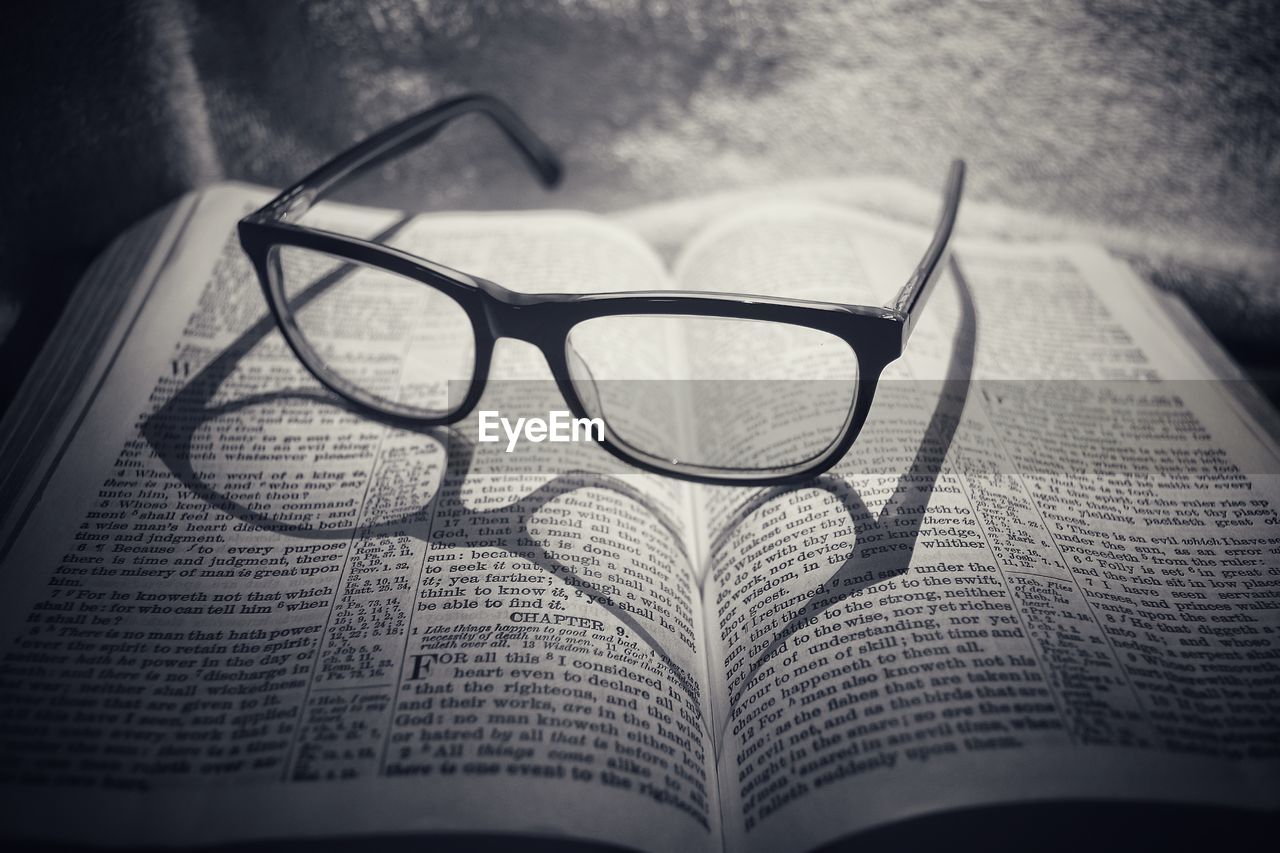 Close-up of eyeglasses on book
