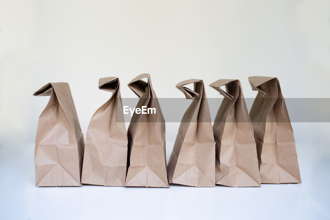 Close-up of paper bags against white background