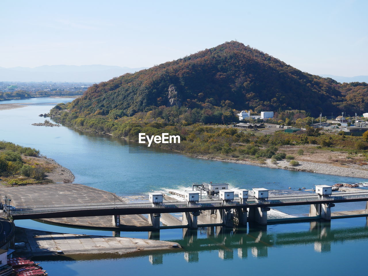 Scenic view of river and mountain against sky