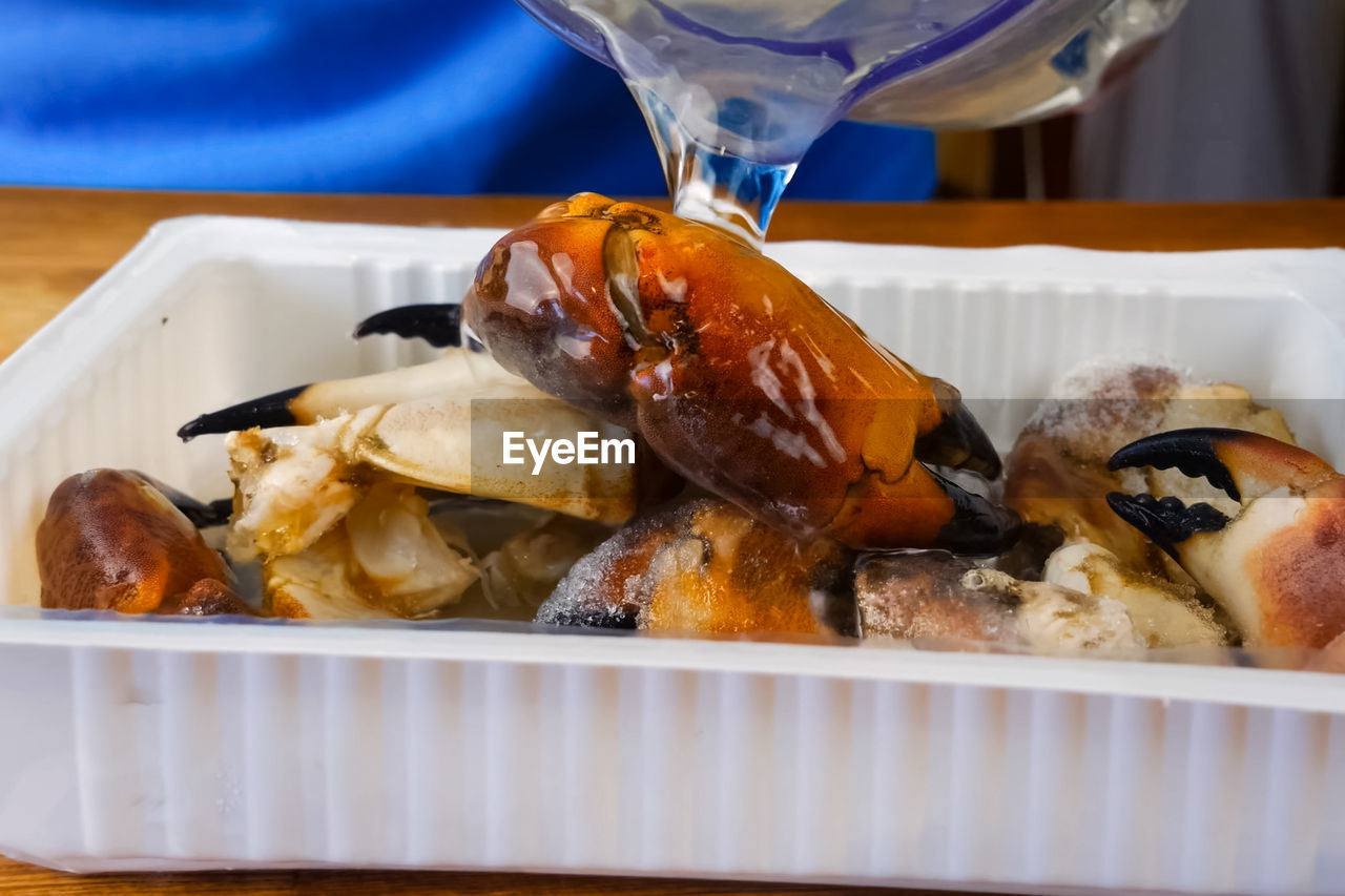 CLOSE-UP OF FOOD SERVED ON TABLE