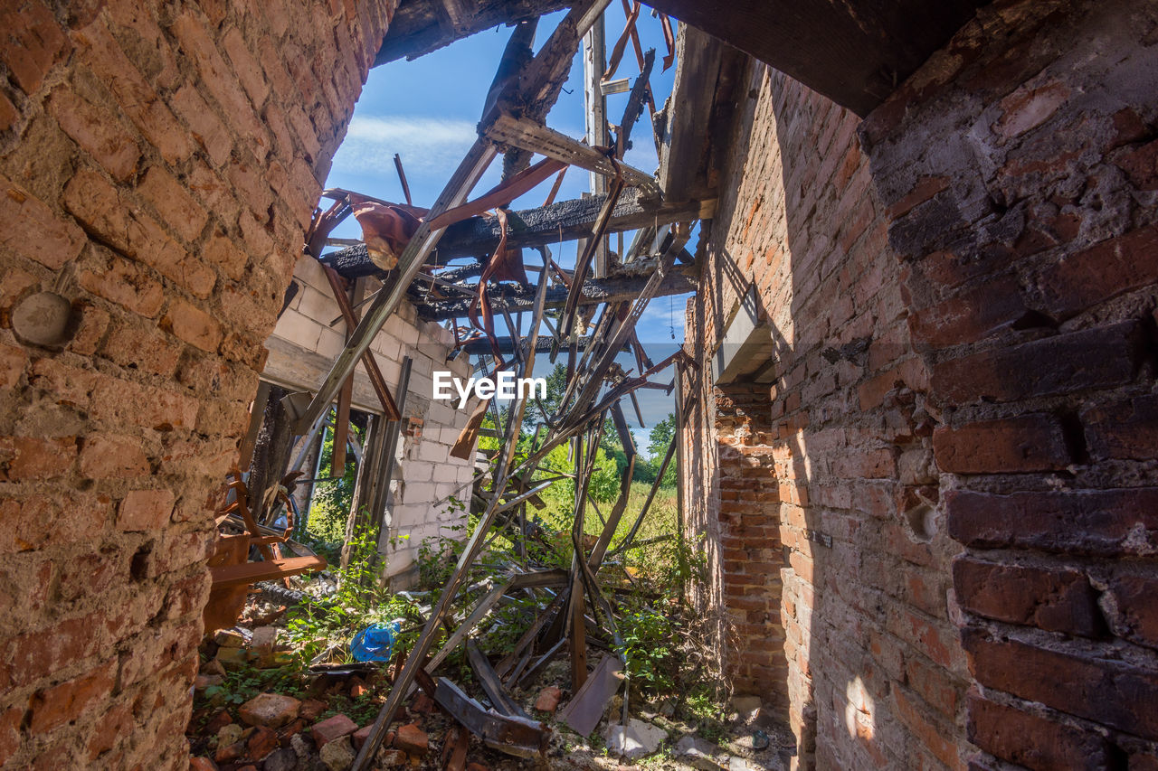 LOW ANGLE VIEW OF DAMAGED BUILDING