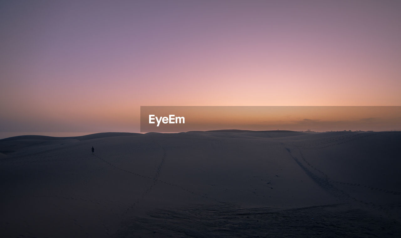 Scenic view of silhouette landscape against sky during sunset