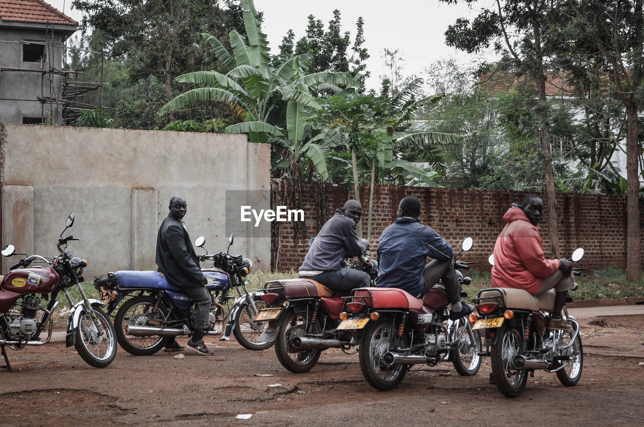 BICYCLES RIDING MOTORCYCLE ON STREET