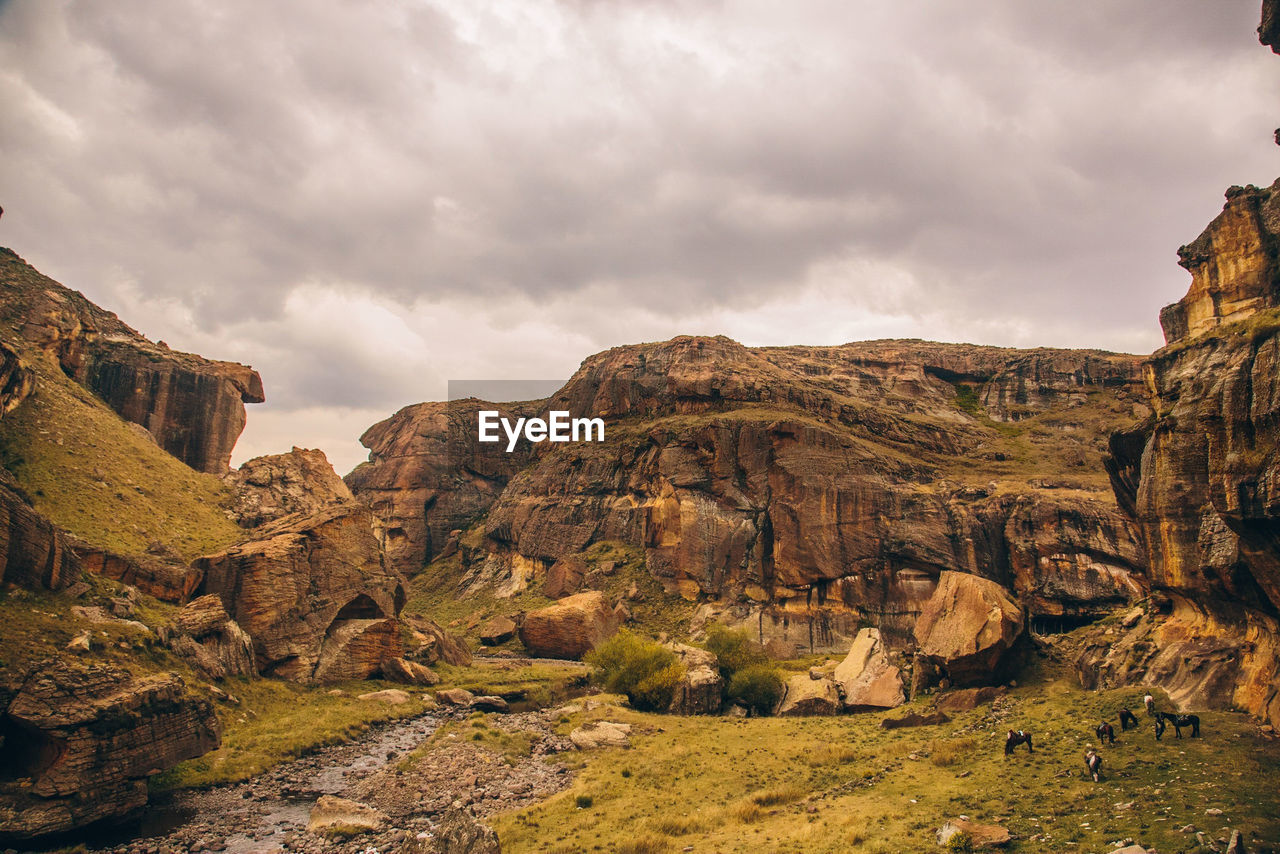 Panoramic view of rocky mountains against sky