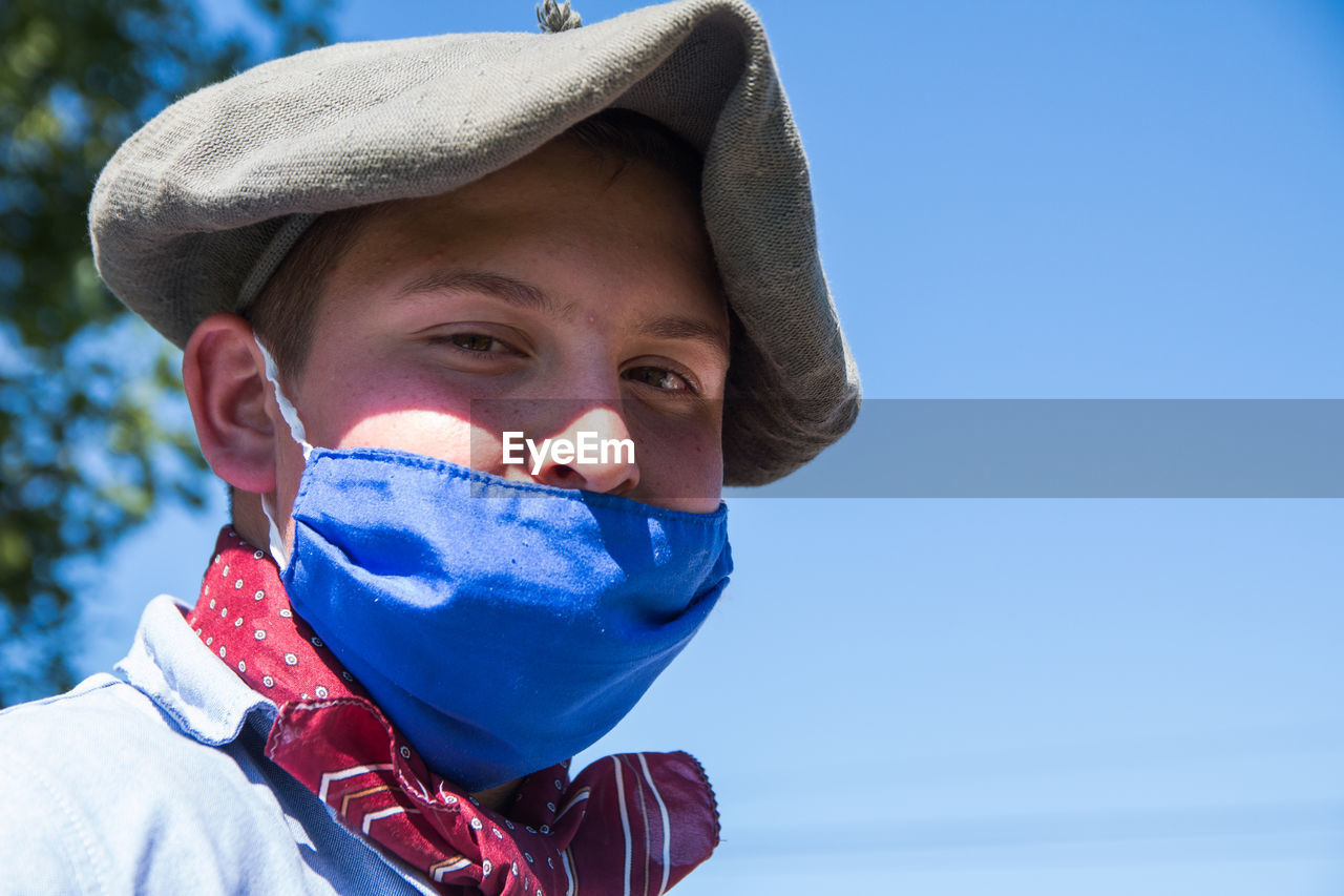 Portrait of south american boy wearing face mask