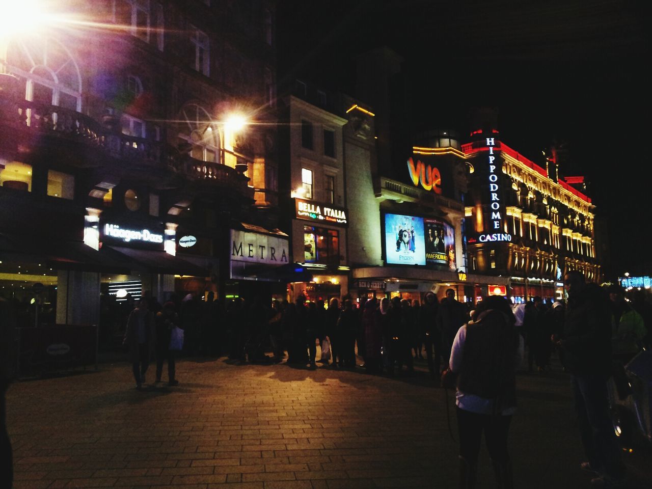 VIEW OF ILLUMINATED STREET LIGHTS AT NIGHT