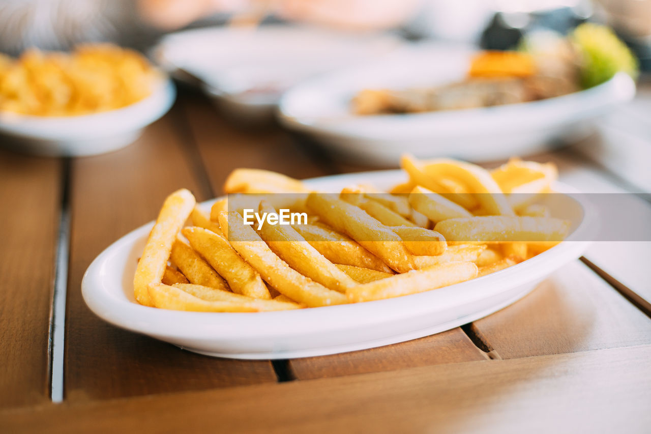 close-up of french fries in plate on table