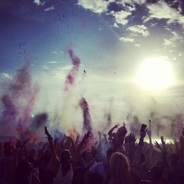 PEOPLE ENJOYING AT CONCERT