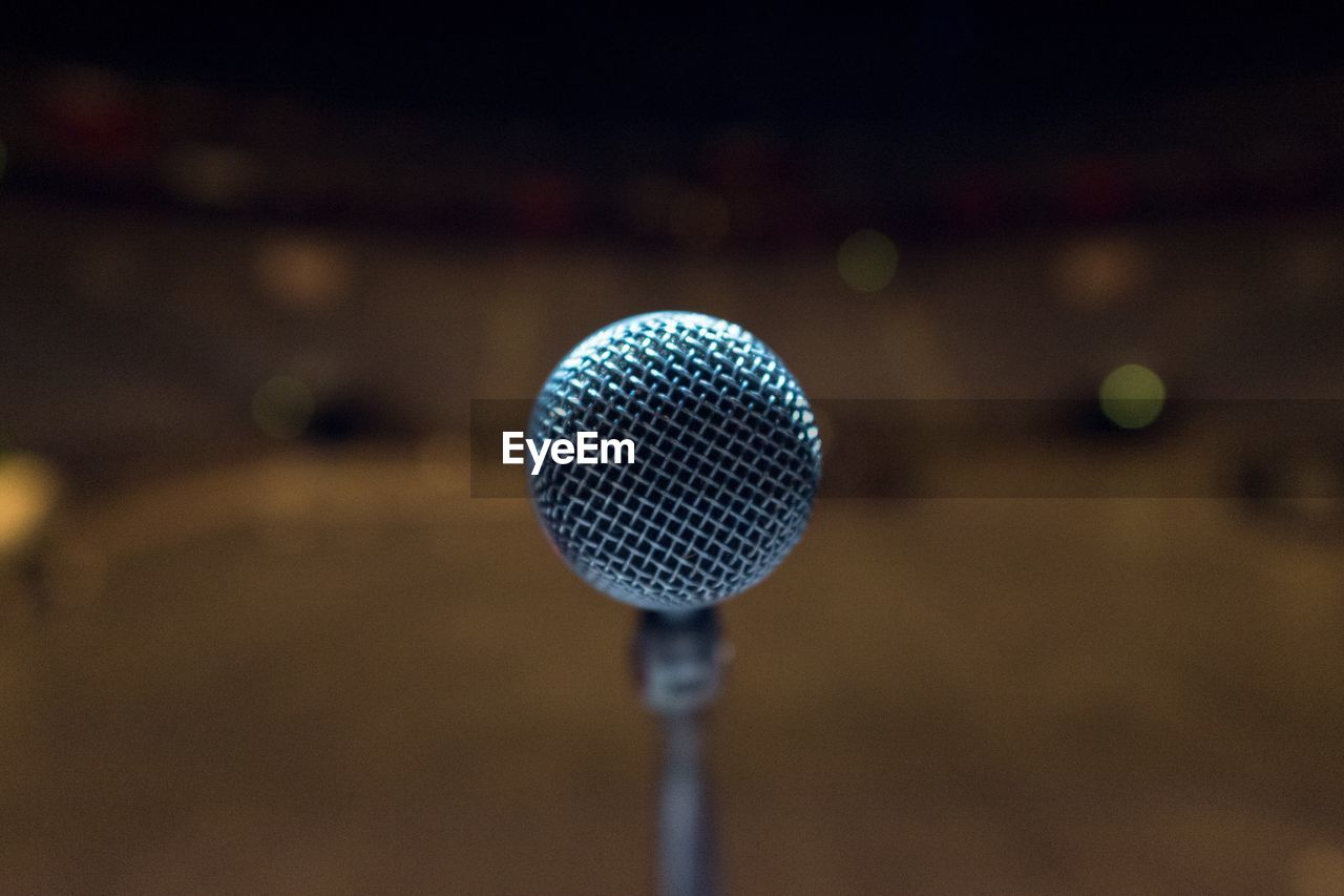 Close-up of microphone on stage