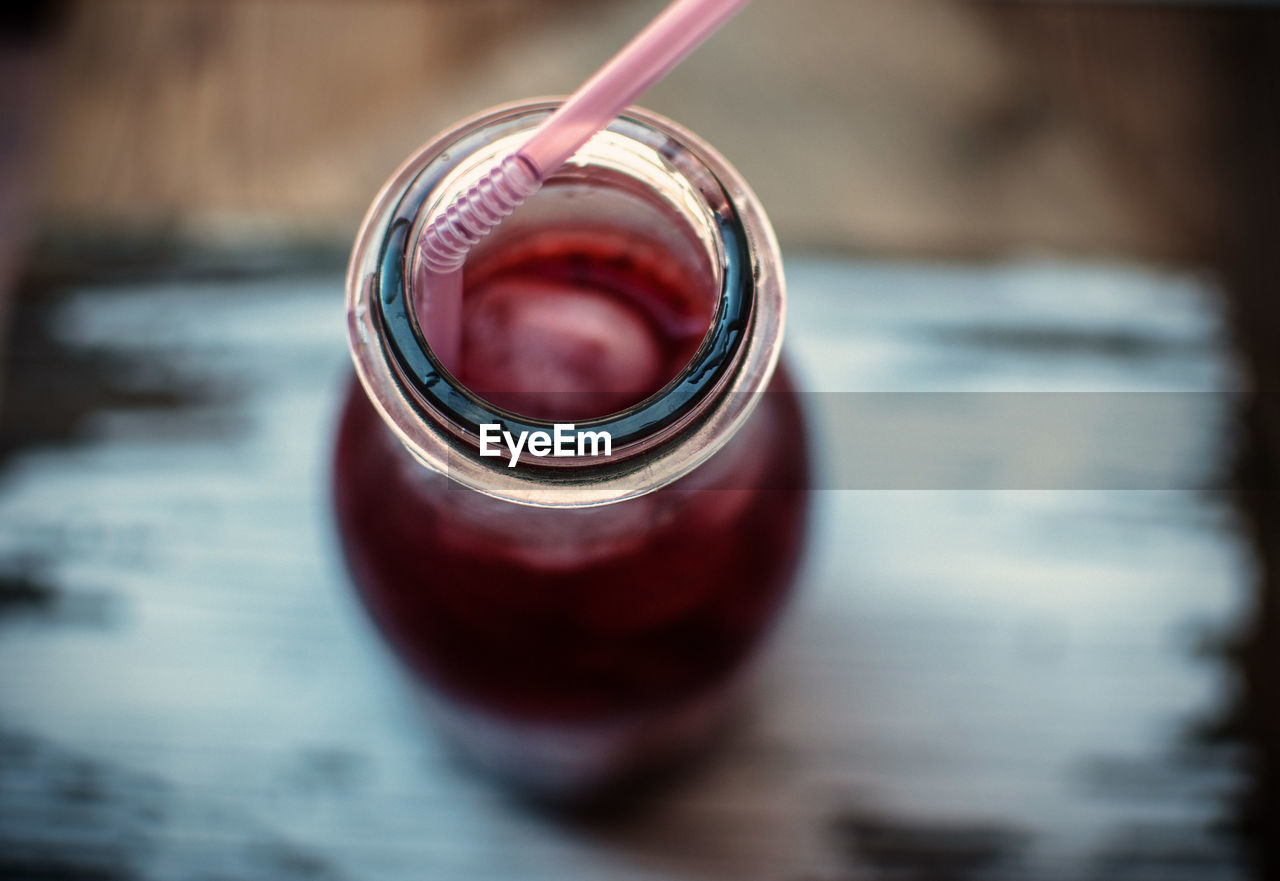 Close-up of drink in glass jar on table