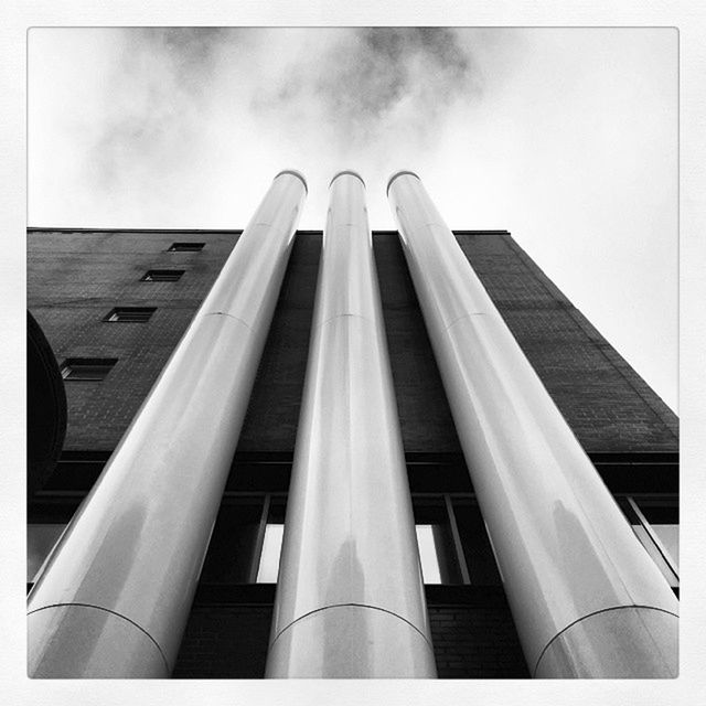 LOW ANGLE VIEW OF MODERN OFFICE BUILDING AGAINST SKY