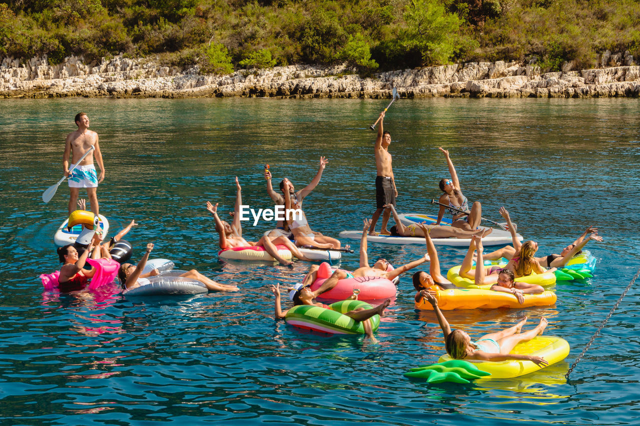 GROUP OF PEOPLE IN WATER