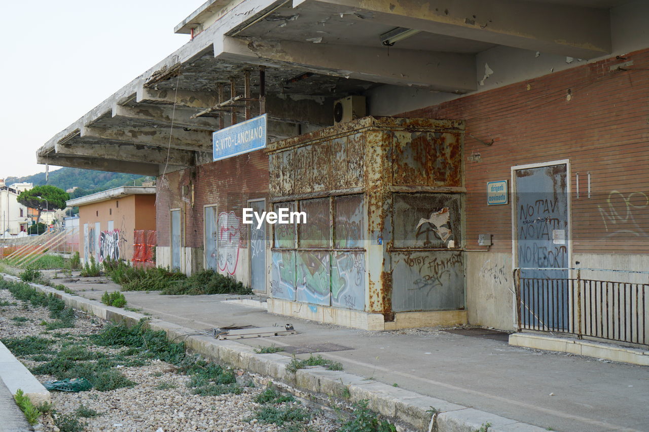 ABANDONED BUILDING BY ROAD