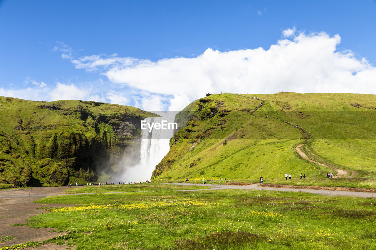 Scenic view of waterfall against sky