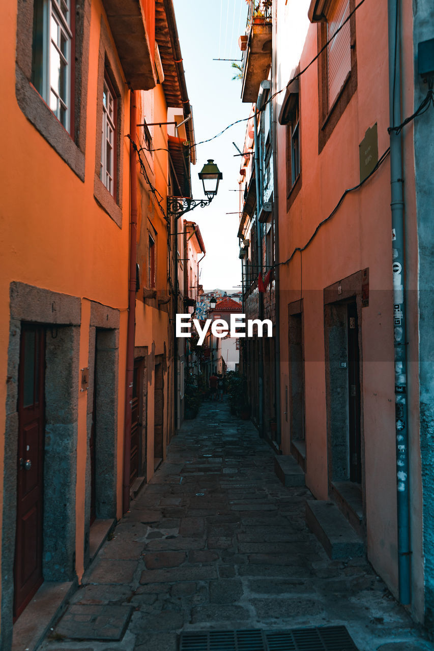 Narrow alley amidst buildings in town