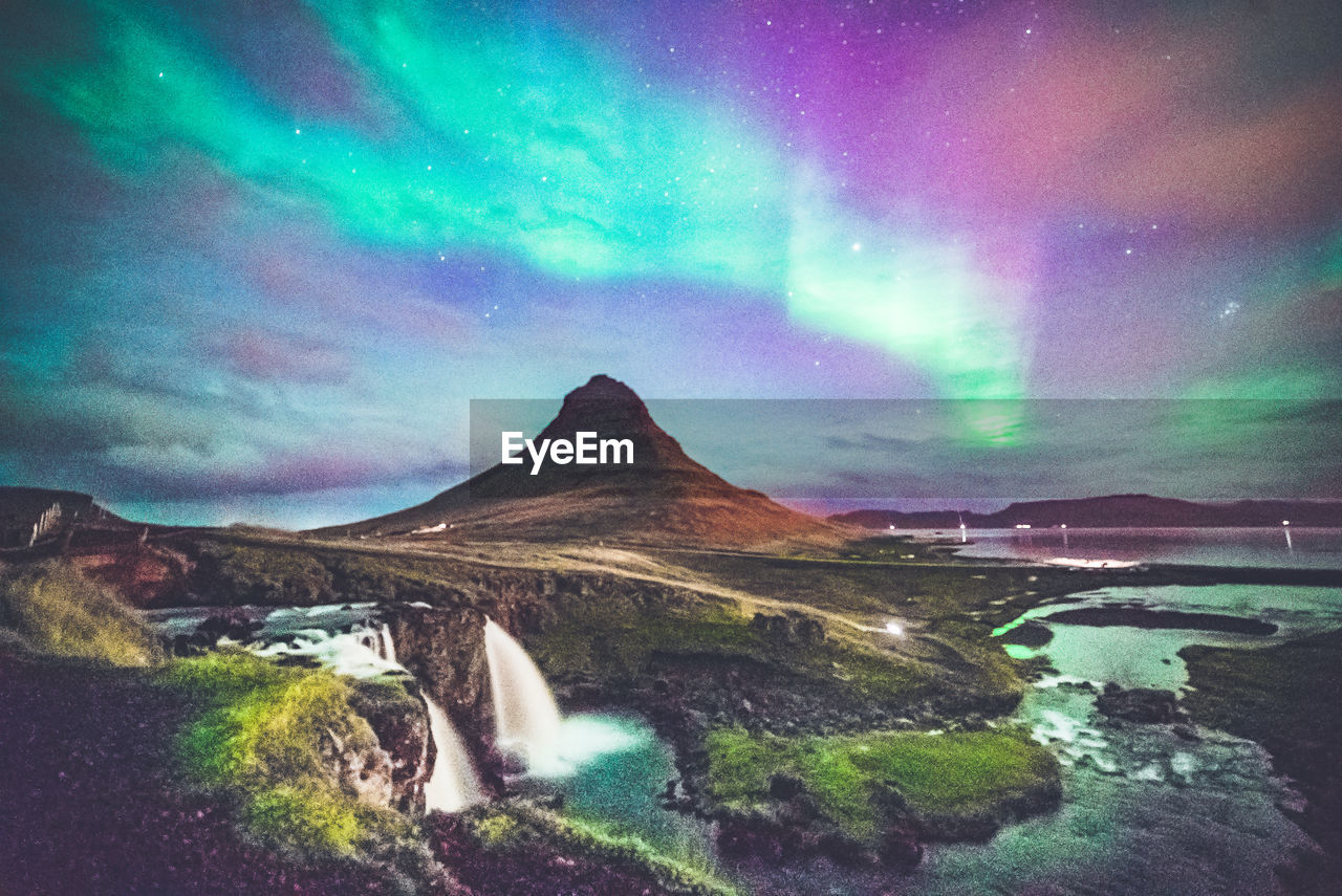 Scenic view of landscape against sky at night