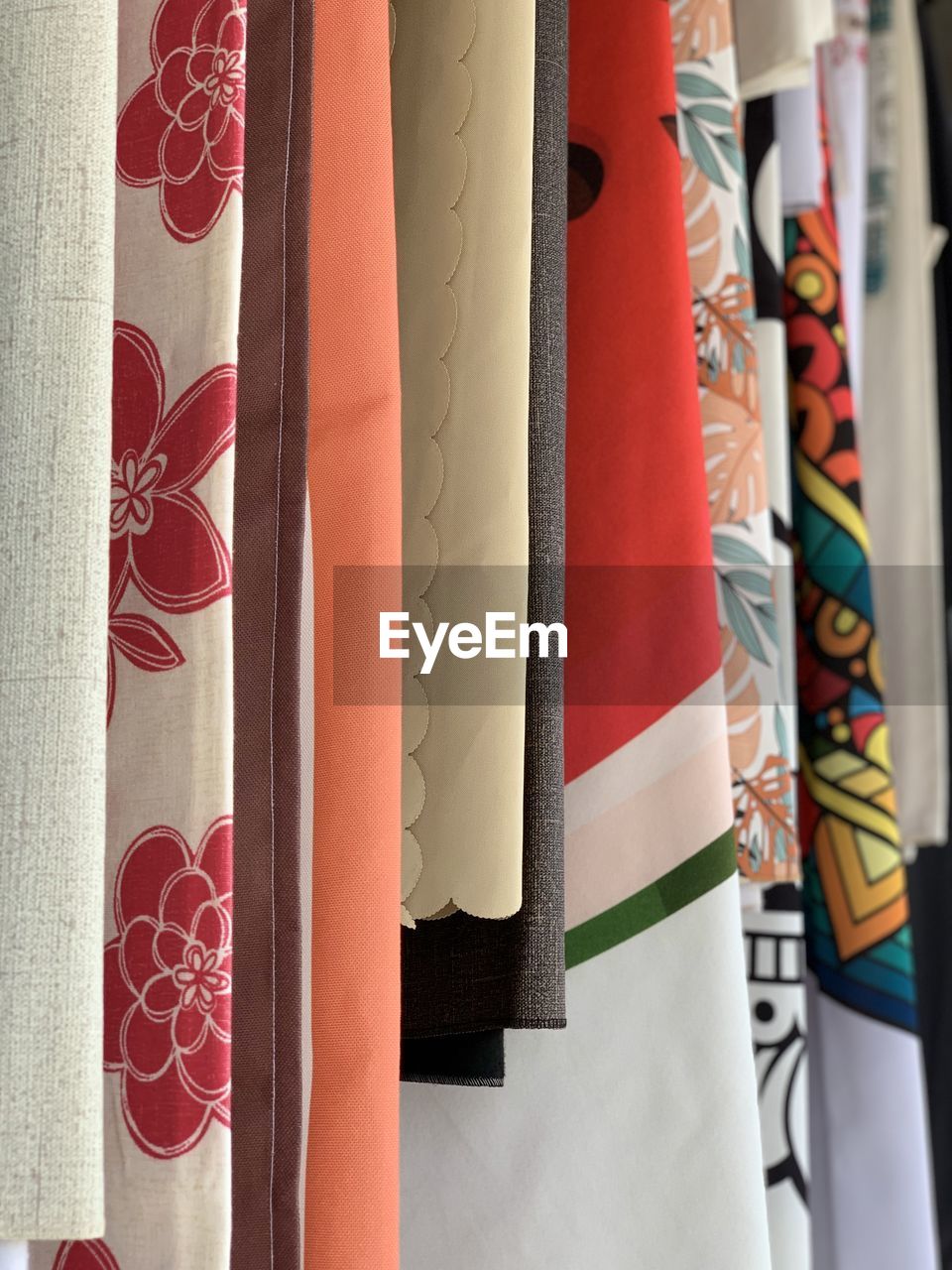 red, interior design, hanging, no people, textile, multi colored, retail, variation, indoors, clothing, in a row, store, art, pattern, close-up, day, curtain, fashion, window treatment