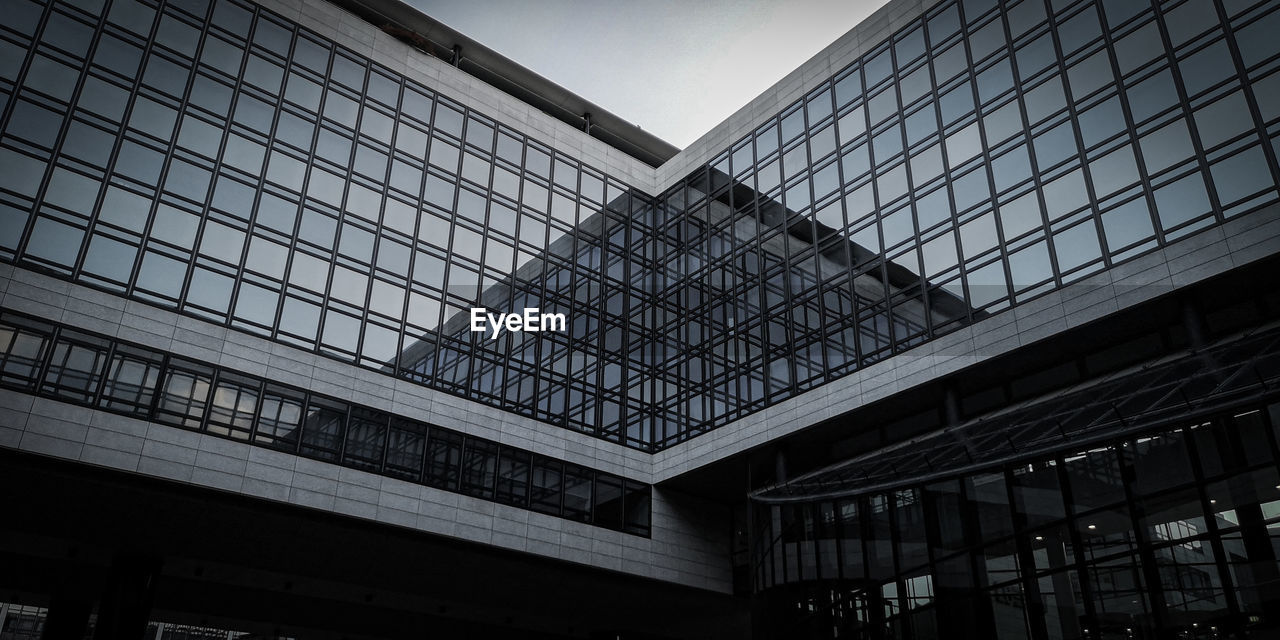 Low angle view of modern building against sky