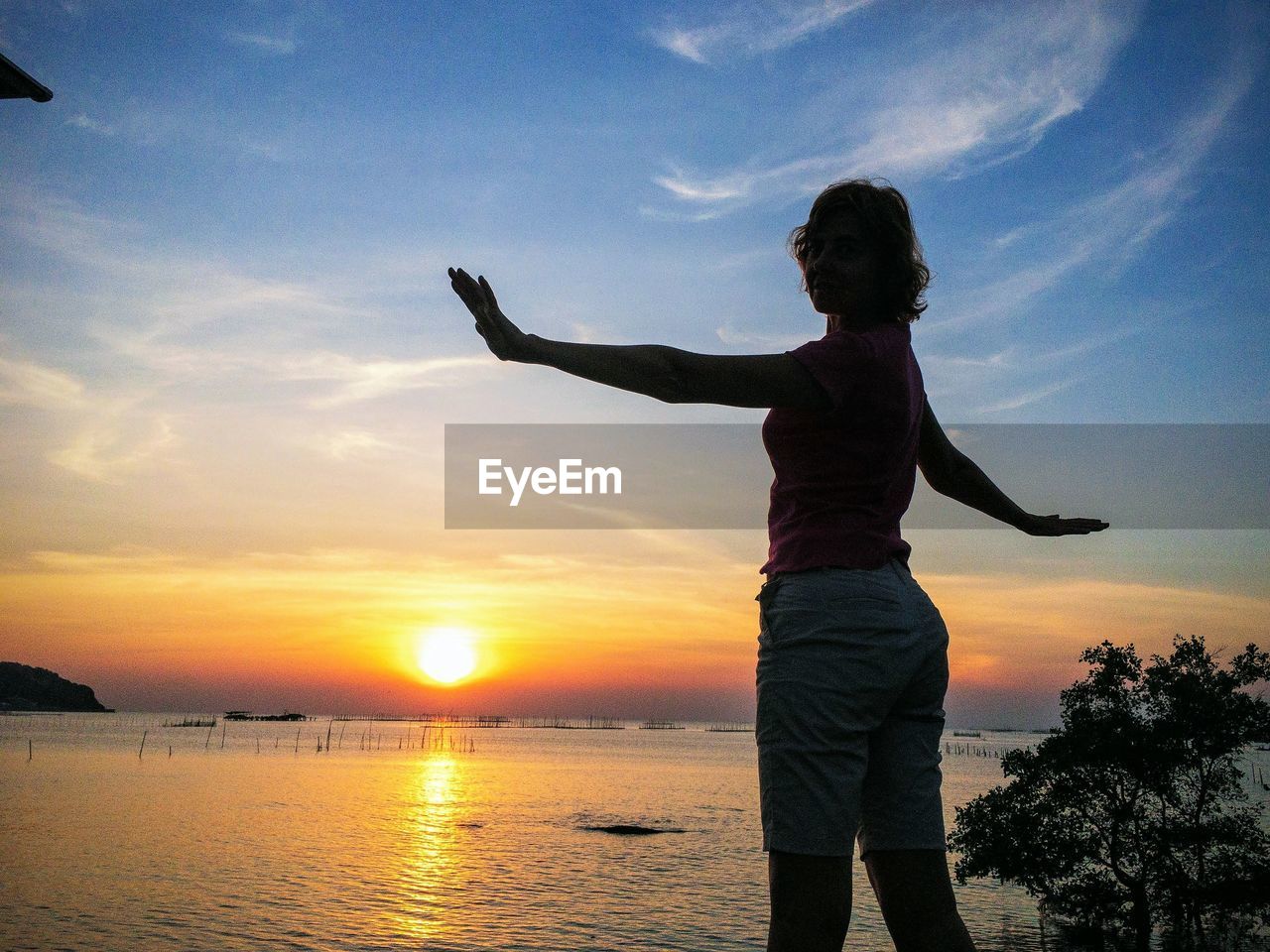 Female silhouette against the sunset