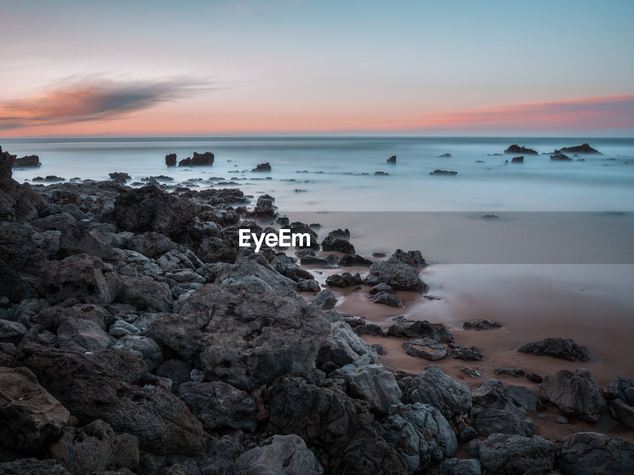 Scenic view of sea against sky during sunset