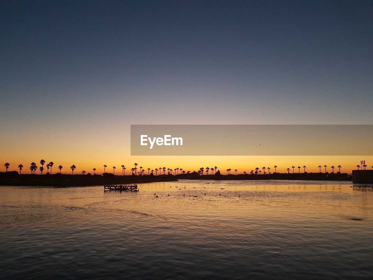 Scenic view of sea at sunset