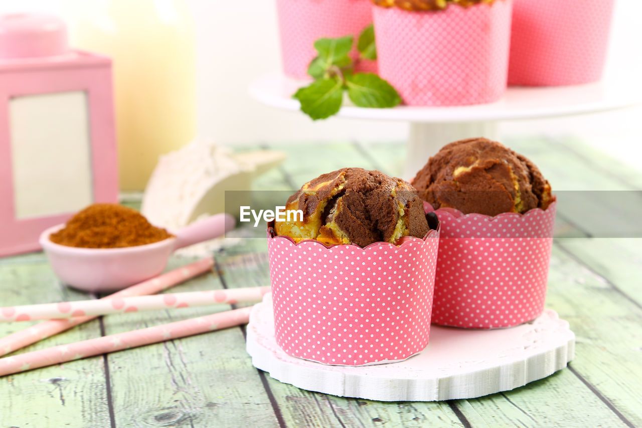 Chocolate muffins on table