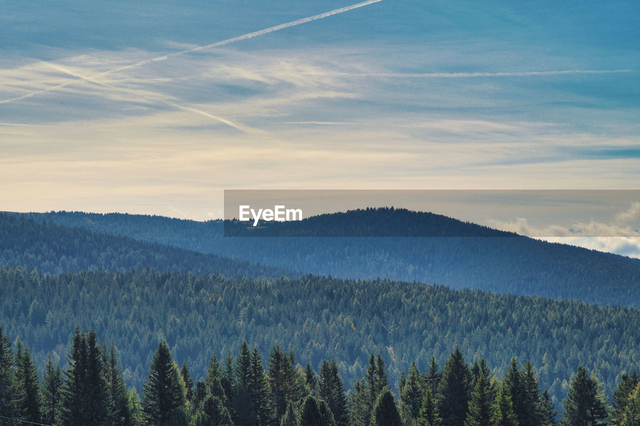 Scenic view of mountains against sky at sunset