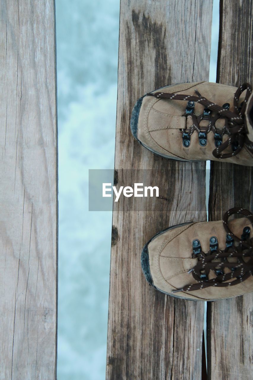 Walking on a broken wooden bridge