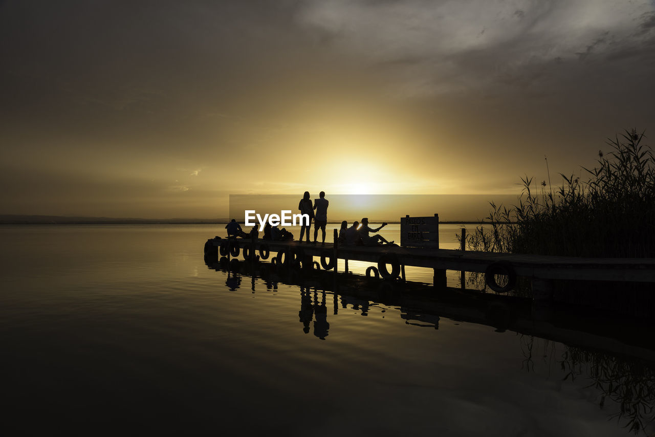 Silhouette of pier at sunset