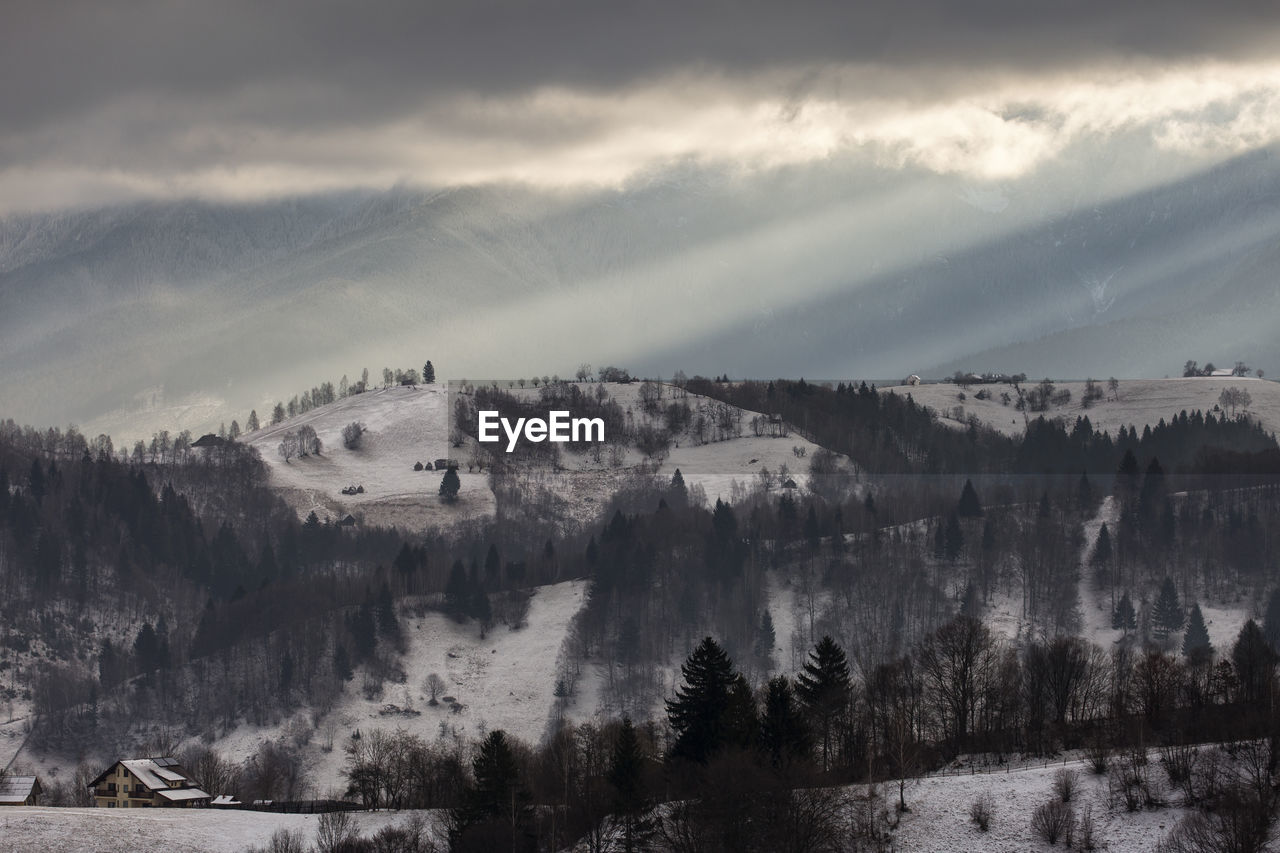 Scenic view of landscape against sky during winter