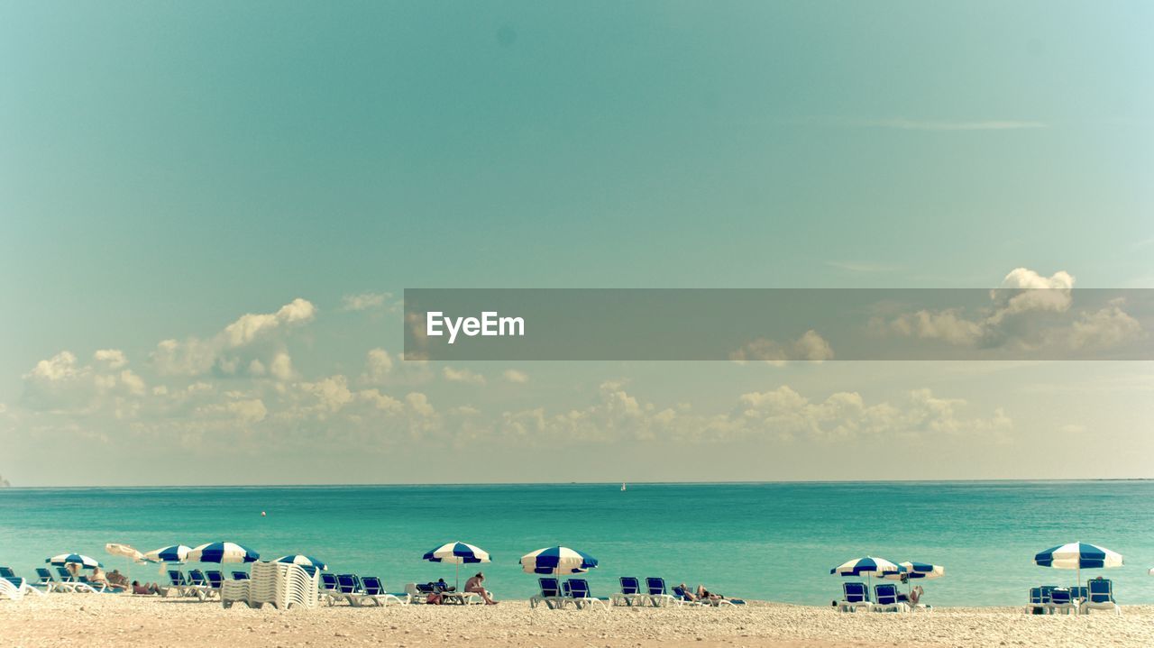 PANORAMIC VIEW OF BEACH AGAINST SKY