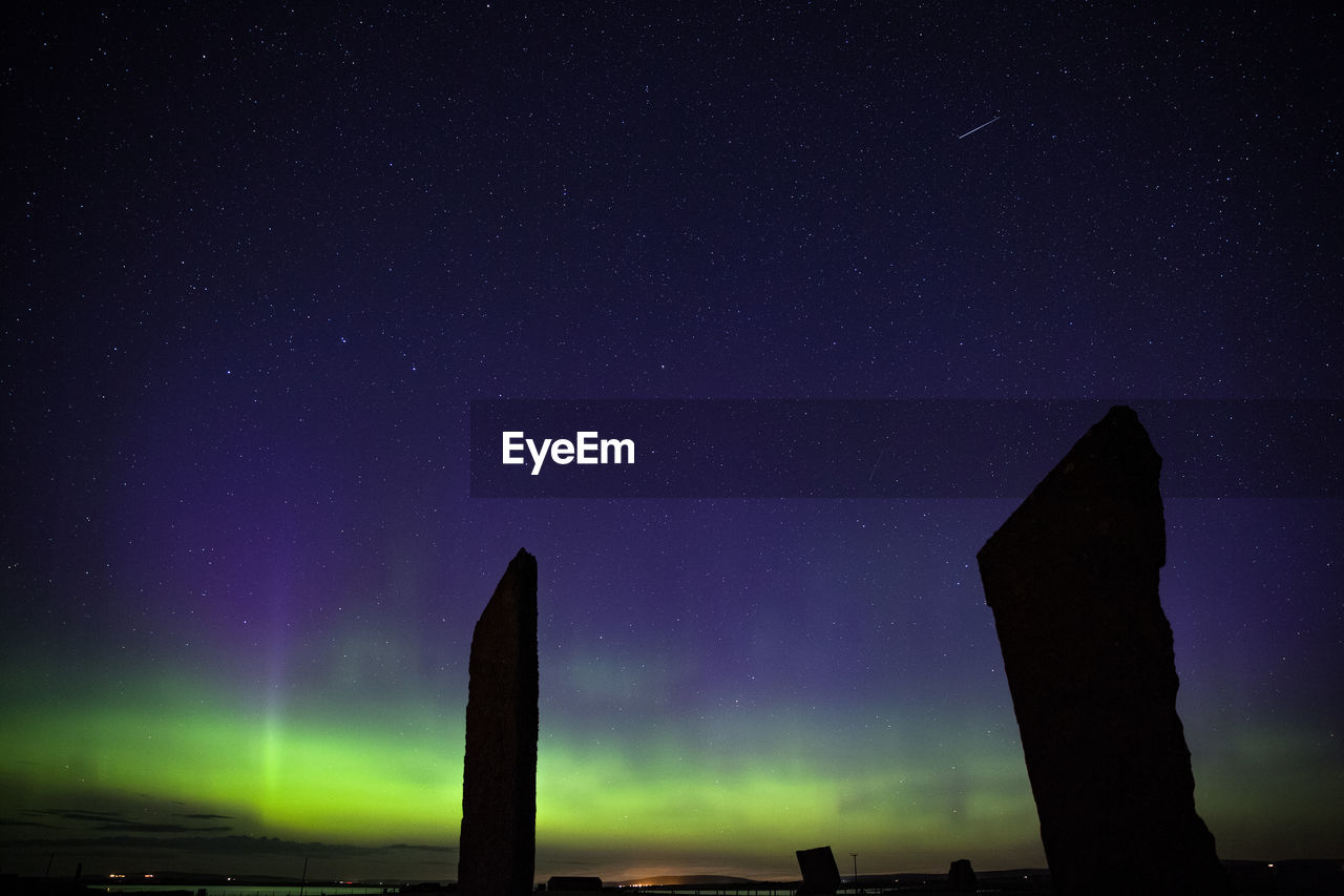 Northern lights with stones of stenness, orkney islands, uk.