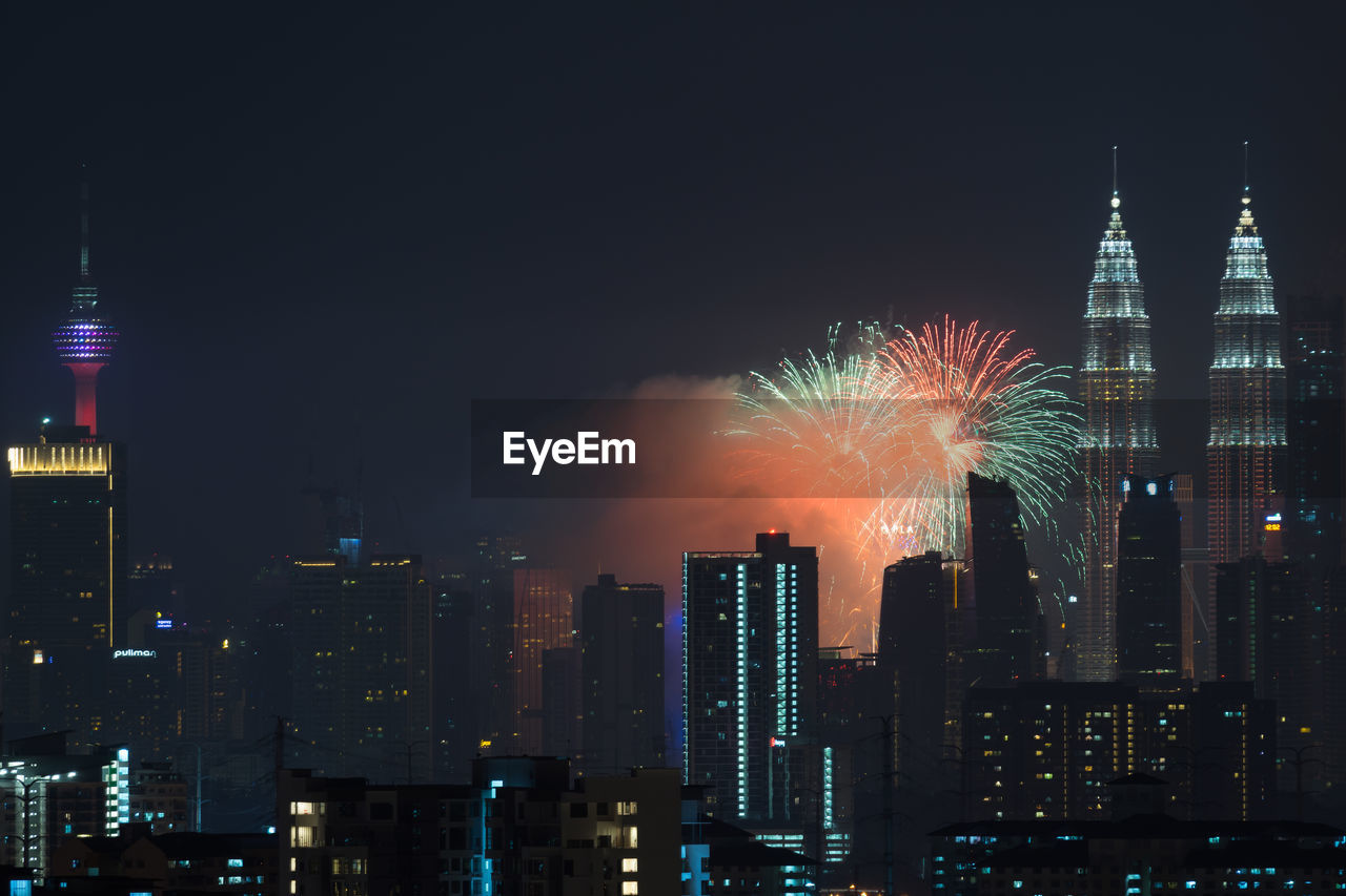 FIREWORK DISPLAY AGAINST SKY AT NIGHT