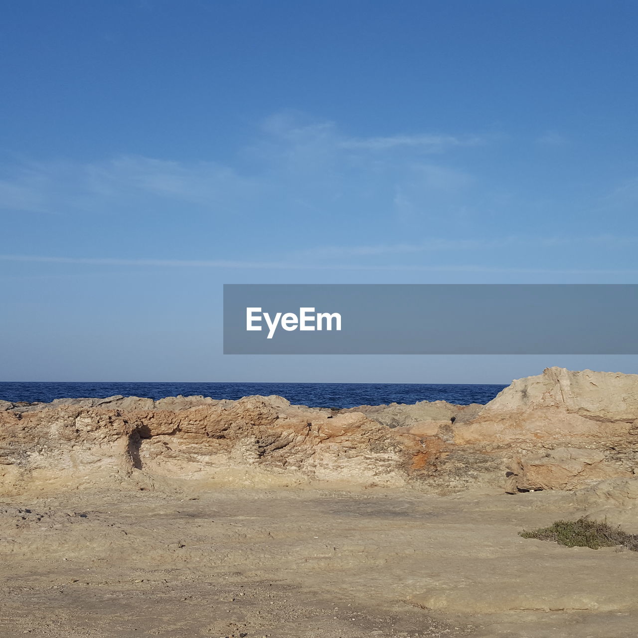 VIEW OF BEACH AGAINST BLUE SKY