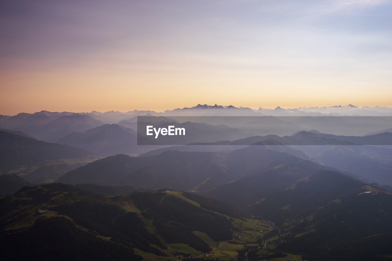 Scenic view of mountains against sky during sunset