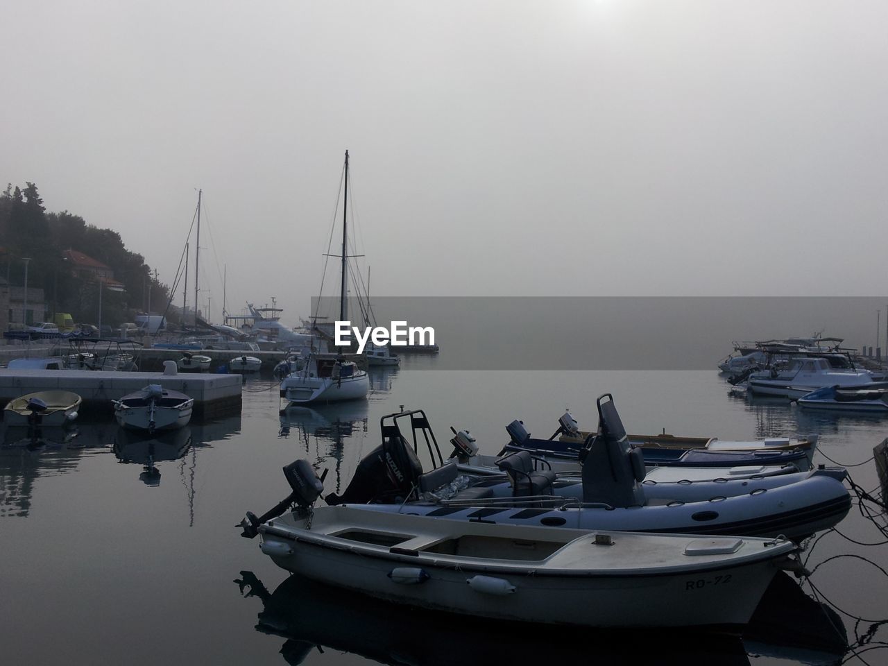 Foggy yacht harbour on croatian island solta