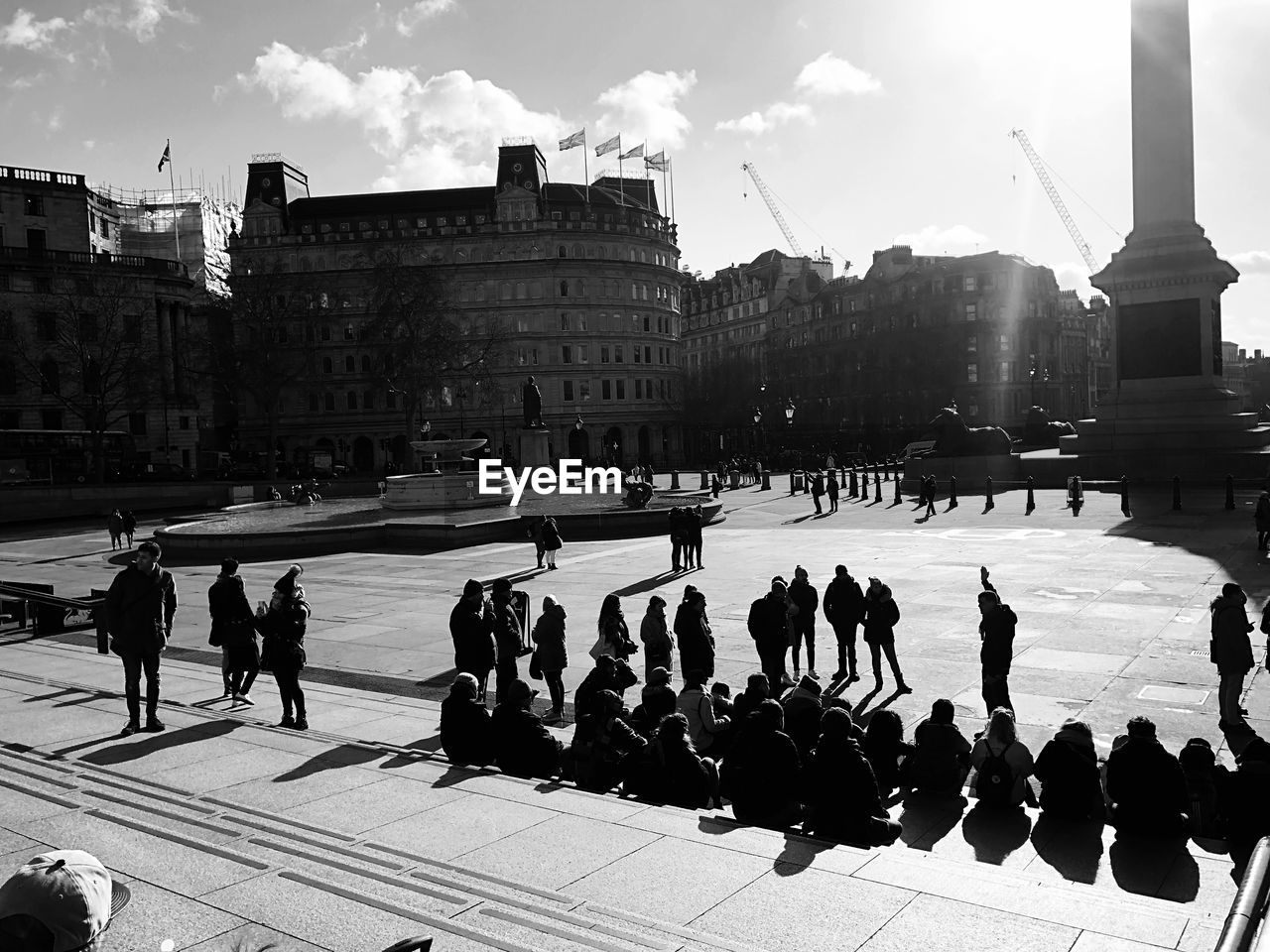 PEOPLE ON STREET BY BUILDINGS IN CITY