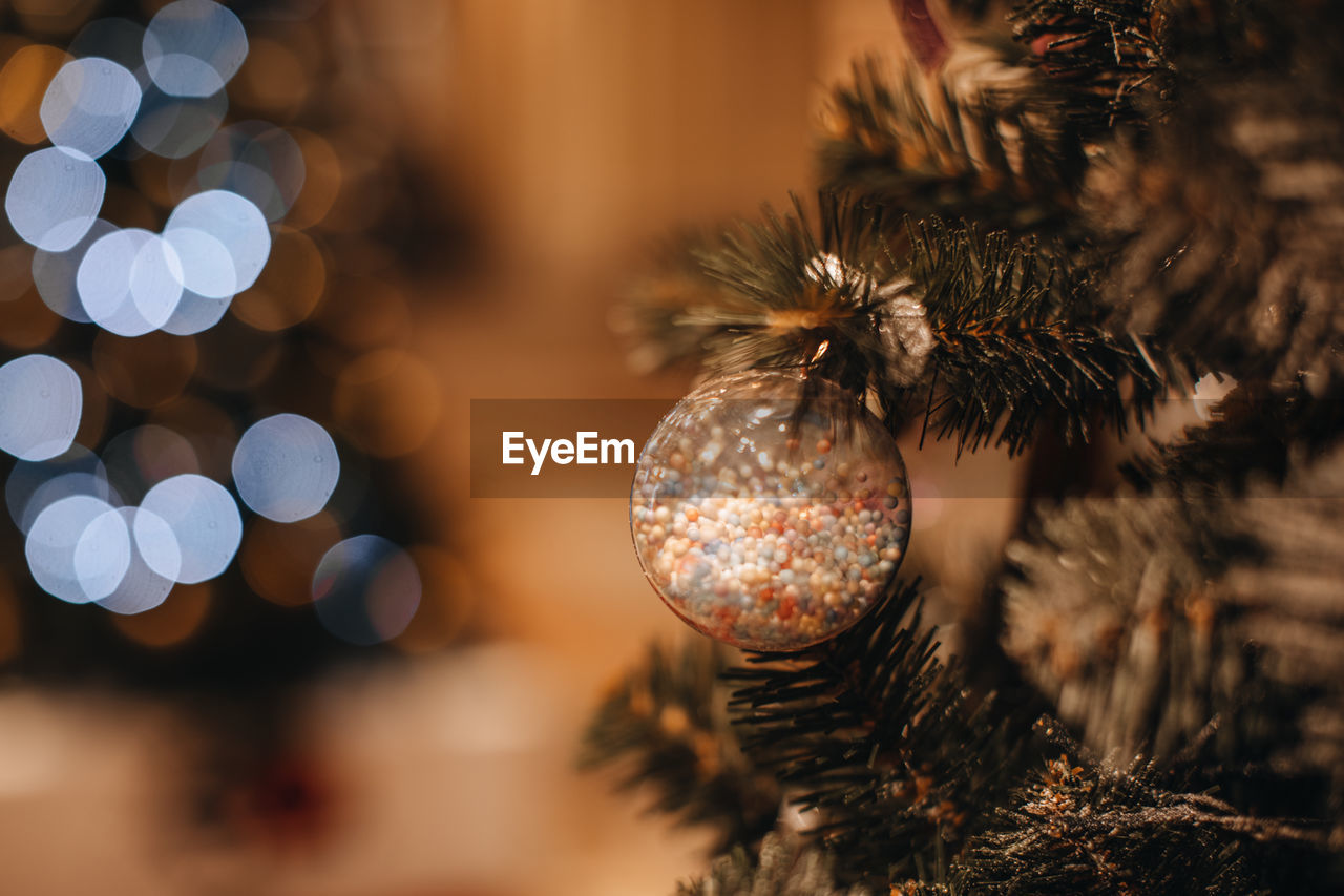 Festive christmas tree decorated with christmas toy silver ball. winter holiday celebration. 