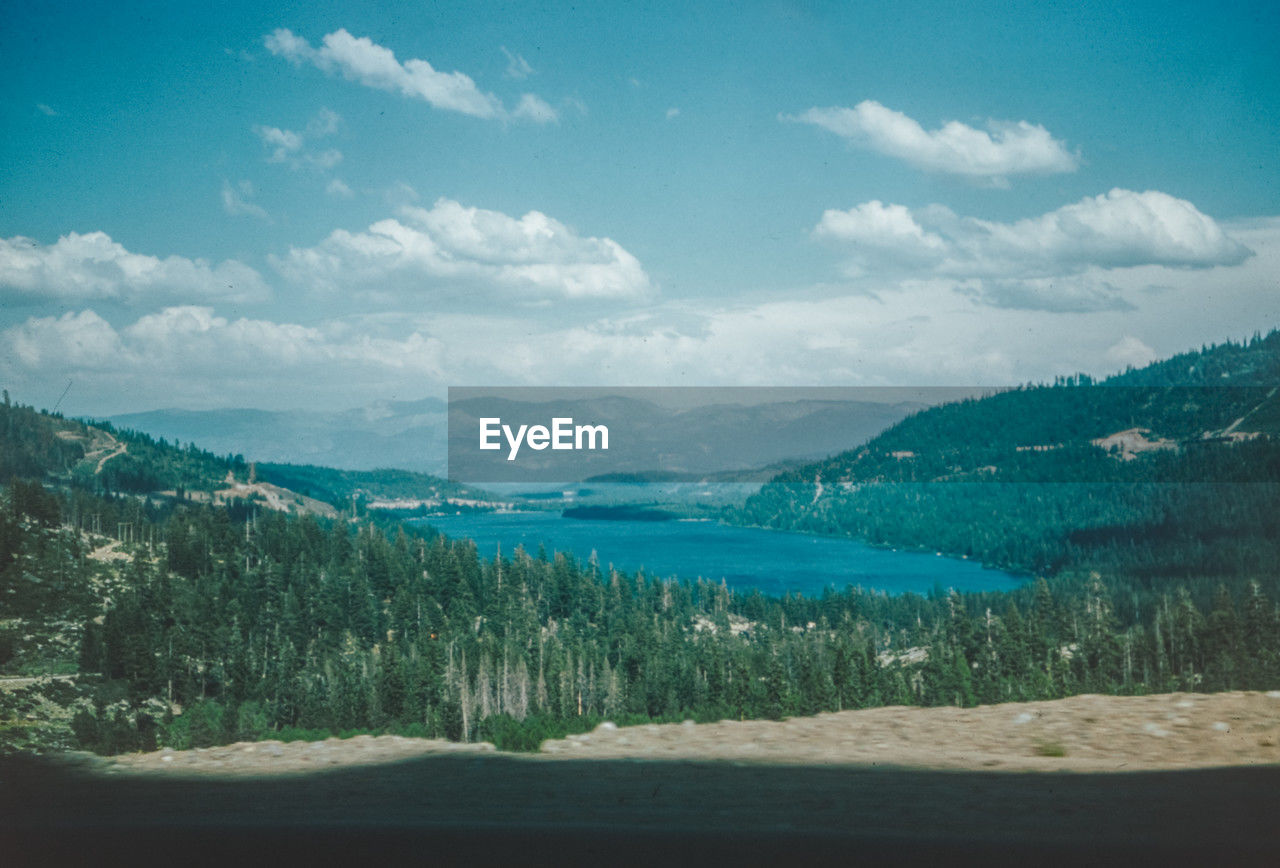 scenic view of landscape and mountains against sky